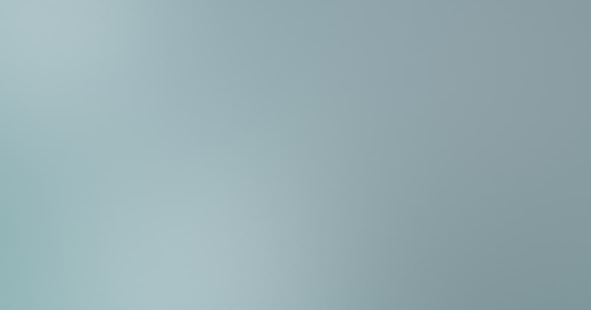 Soft mist-style gradient in silver blue and teal tones representing AI-powered product feed distribution in ecommerce